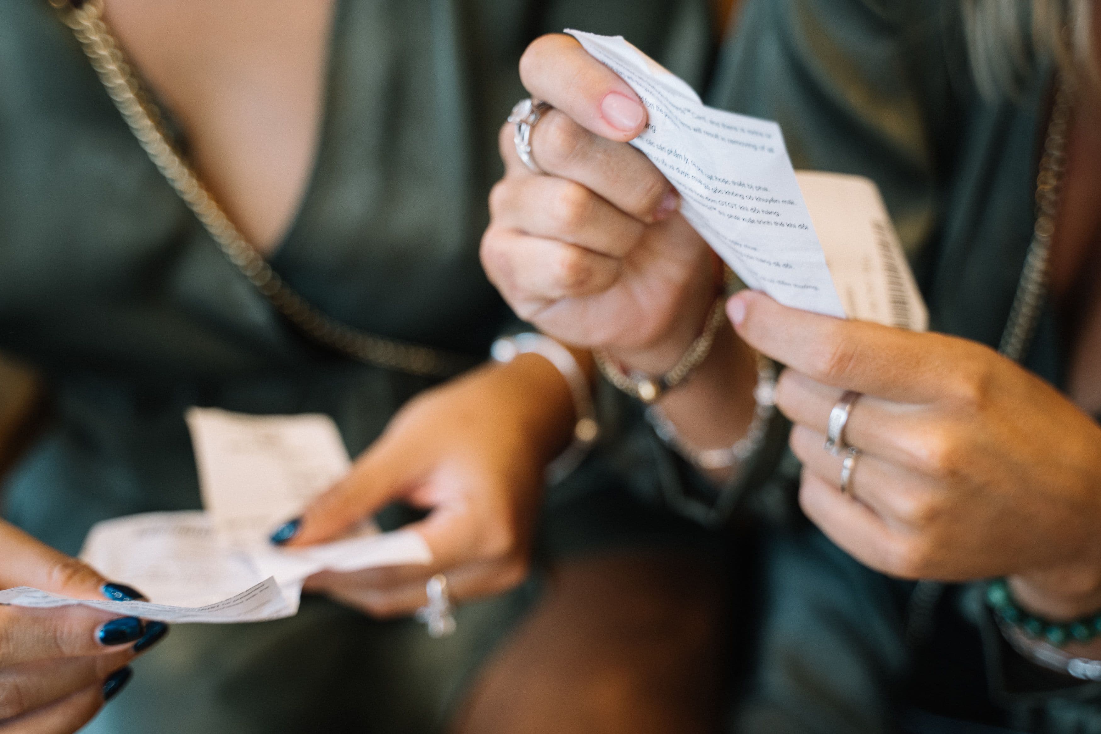 Hands reviewing receipts and proof of purchase